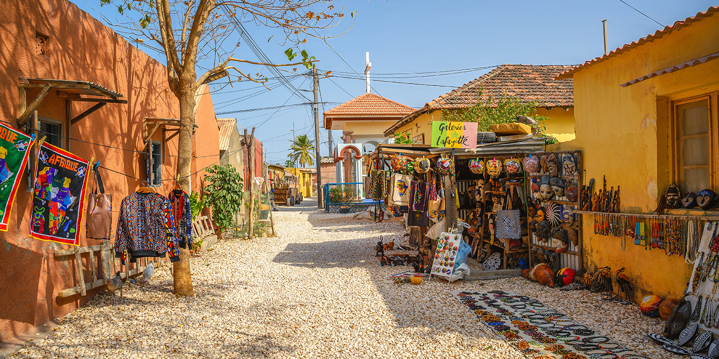 Traditional market street in Joal Fadiouth, Senegal, with artisan crafts